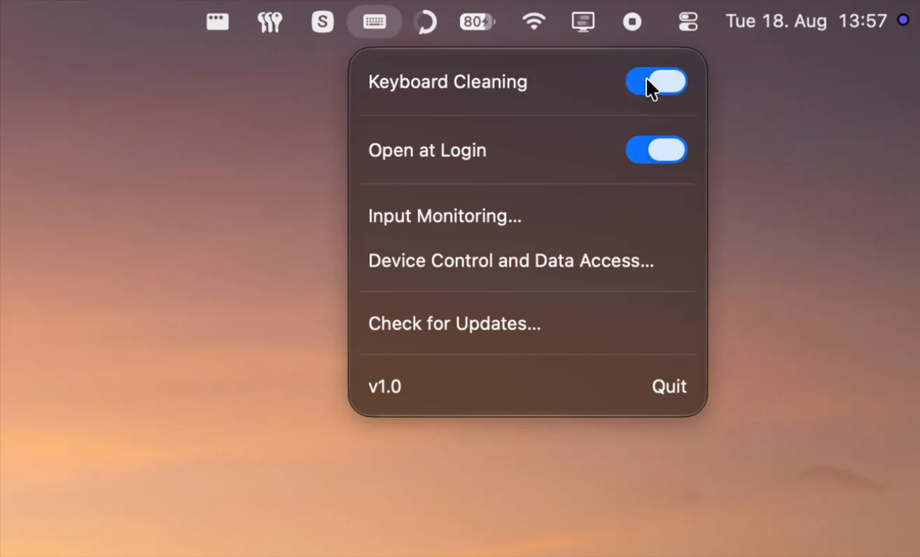 The Cleankey menu-bar popover with Keyboard Cleaning switched on, Open at Login enabled, both permission rows, an update check and the version and Quit row