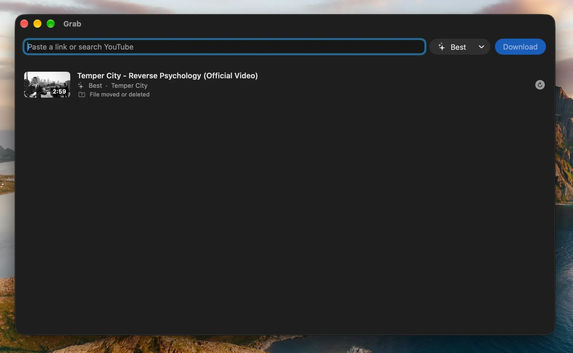 Grab's main window: a link field with a Best quality menu and a Download button, above one finished download with its thumbnail, title and channel