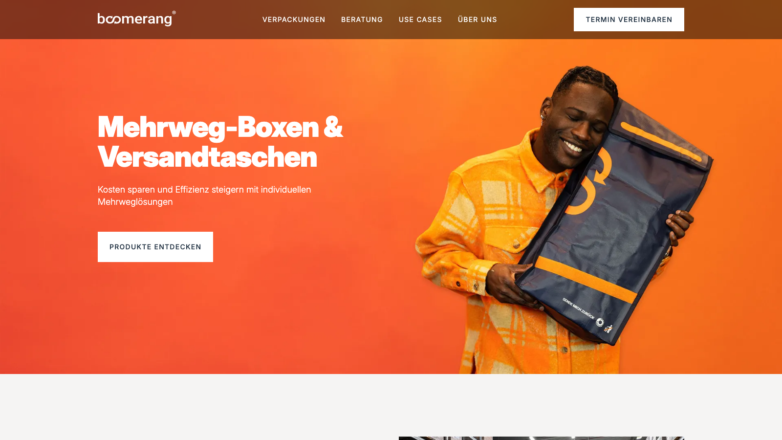 Boomerang homepage hero showing a courier holding a reusable shipping bag